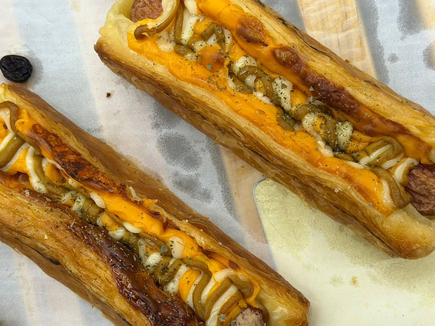 Mustard cheese sausage danish with melted cheese